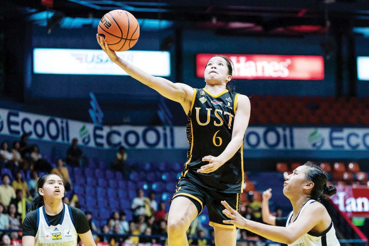 Negrense Barby Dajao of the University of Santo Tomas Junior Growling Tigresses stretches for a layup. (UAAP photo)