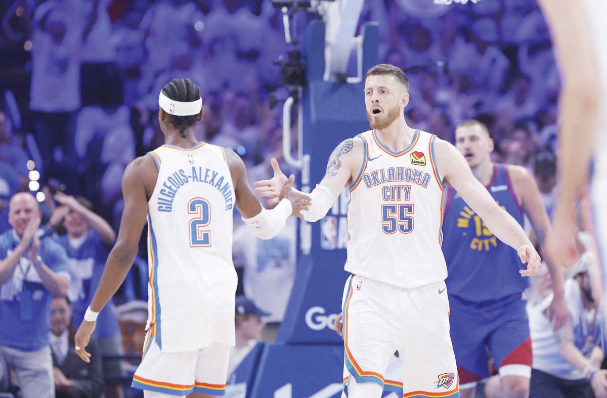 Isaiah Hartenstein (right) and Shai Gilgeous-Alexander celebrate after scoring against the Denver Nuggets during Game 5 of the NBA Playoffs. (Alonzo Adams / Imagn Images / Reuters)