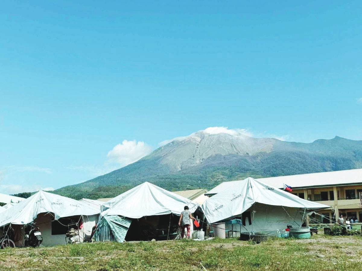 A quiet Kanlaon Volcano is seen behind an evacuation camp in Negros Oriental’s Canlaon City as the city government prepares to allow evacuees to return home outside the four-kilometer permanent danger zone. (Canlaon City PIO / Emergency Operations Center photo)
