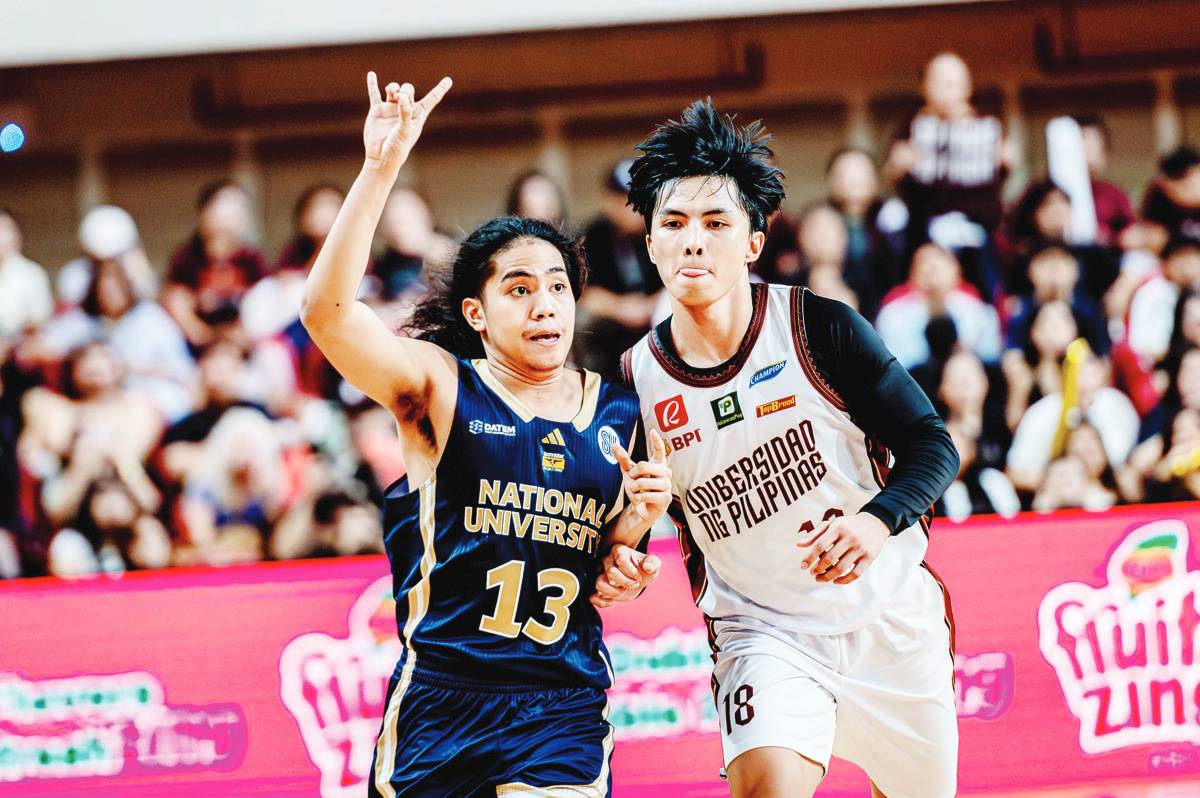 Negrense Harold Alarcon of the University of the Philippines Fighting Maroons tightly guards National University Bulldogs' Steve Nash Enriquez. (UAAP photo)