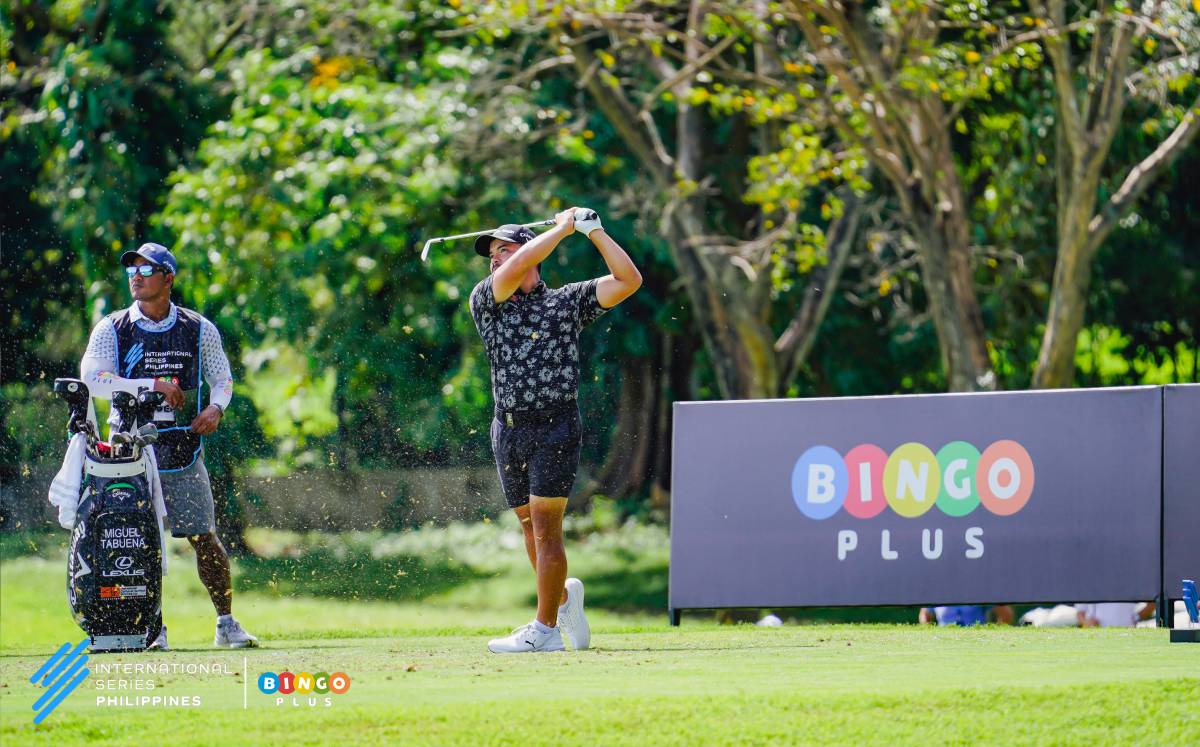 Miguel Tabuena and caddie Lan, swinging above the odds