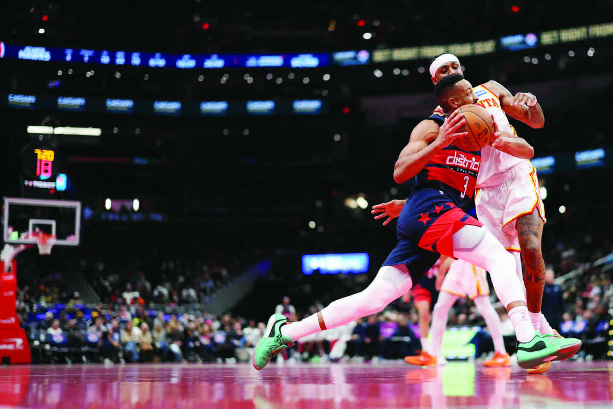 McCollum’s 46 downs Hawks, gives Wizards 1st win
