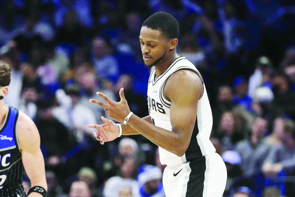 San Antonio Spurs guard De'Aaron Fox reacts after a three-point basket against the Orlando Magic. (Nathan Ray Seebeck / Imagn Images)