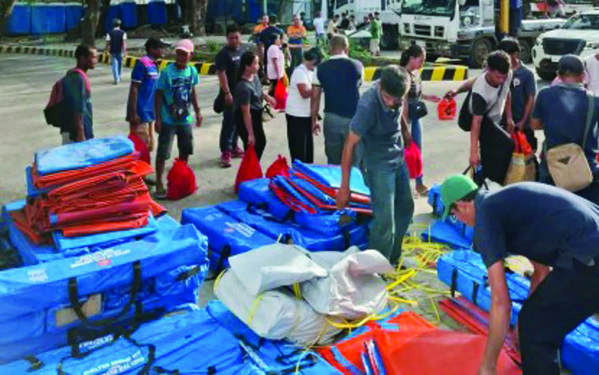 Typhoon-affected residents of Bago City in Negros Occidental receive family tents and other shelter relief assistance from the Office of Civil Defense and the Department of Human Settlements and Urban Development on December 11, 2025. The Office of Civil Defense in the Negros Island Region says the provisions are intended to offer immediate relief to the affected families and help them restore safe and functional living spaces. (OCD-NIR photo)