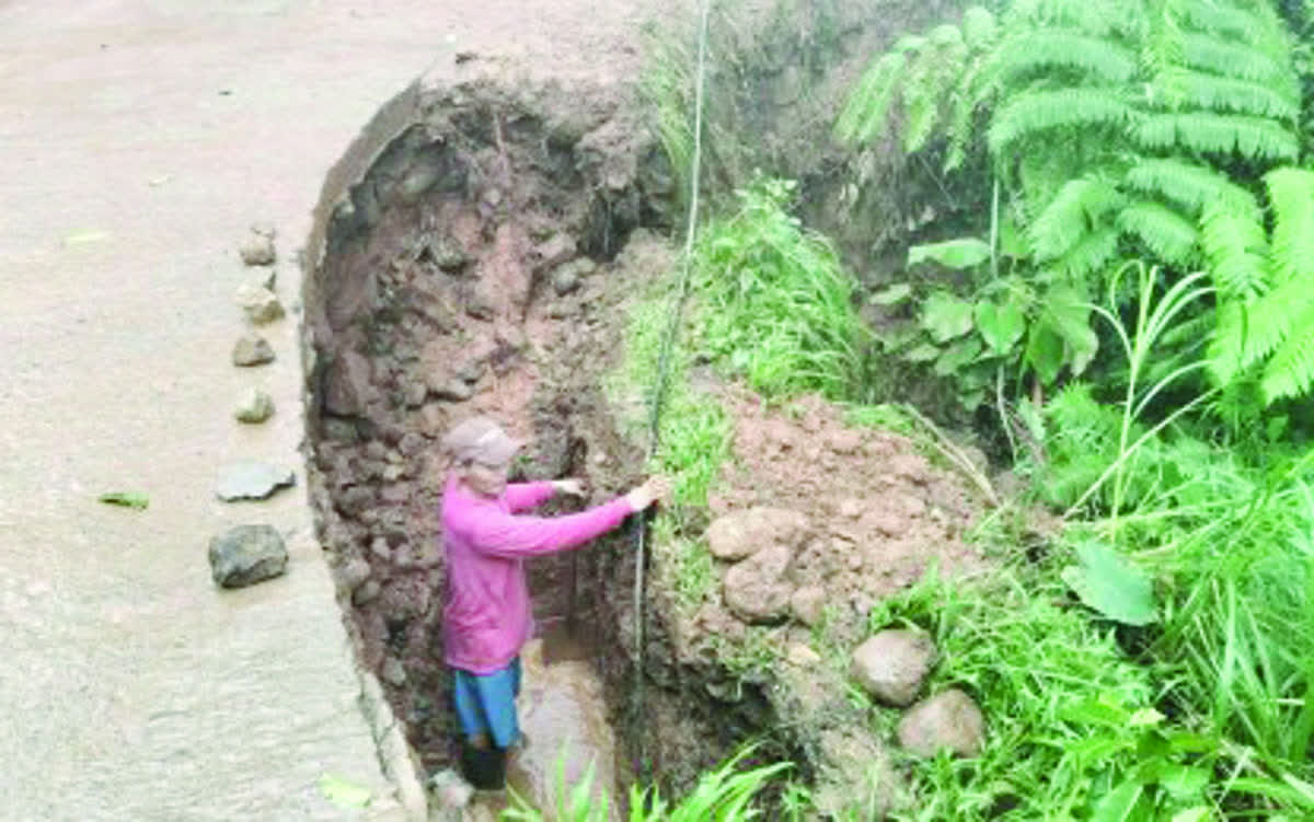 A collapsed road shoulder in Bindoy, Negros Oriental during a damage assessment by the Local Disaster Risk Reduction and Management Office yesterday, January 6, 2026. Bindoy is one of several areas in the province hit by heavy rainfall and flooding. (Bindoy LDRRMO / Facebook photo)