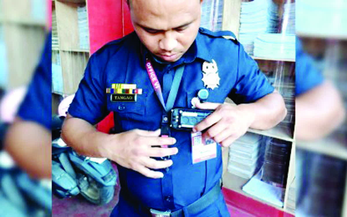 A fire safety inspector of the Bacolod City Fire Station sets up the body-worn camera (BWC) now mandatory during inspections to be conducted by the Bureau of Fire Protection nationwide. The Bacolod City Fire Station has 24 units of BWCs for its 48 inspectors. (BFP-Bacolod City Fire Station photo)