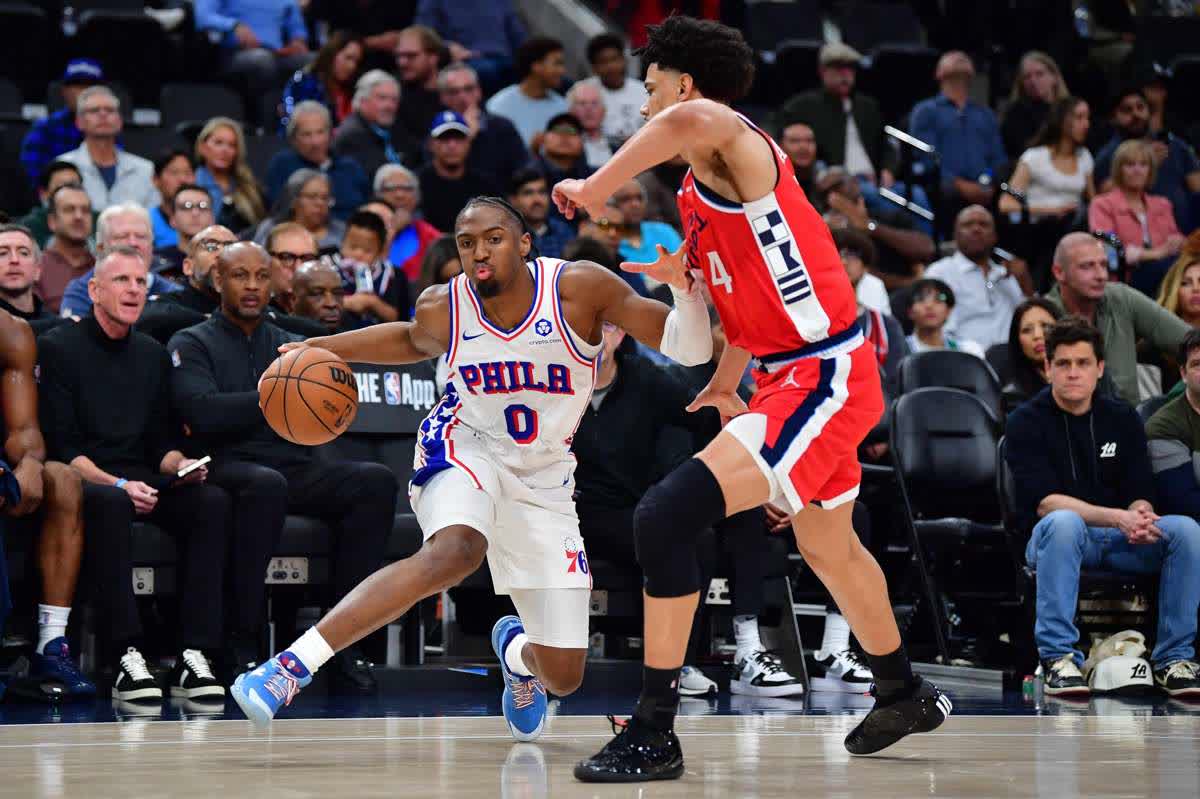Philadelphia 76ers guard Tyrese Maxey (left) moves the ball against Los Angeles Clippers guard Kobe Sanders. (Gary A. Vasquez / Imagn Images)