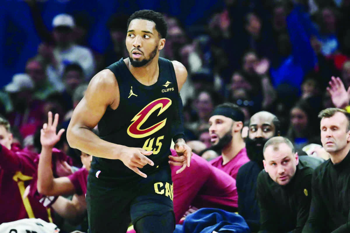 Cleveland Cavaliers guard Donovan Mitchell (45) celebrates after hitting a three-point basket during the first half against the Brooklyn Nets. (Ken Blaze / Imagn Images)