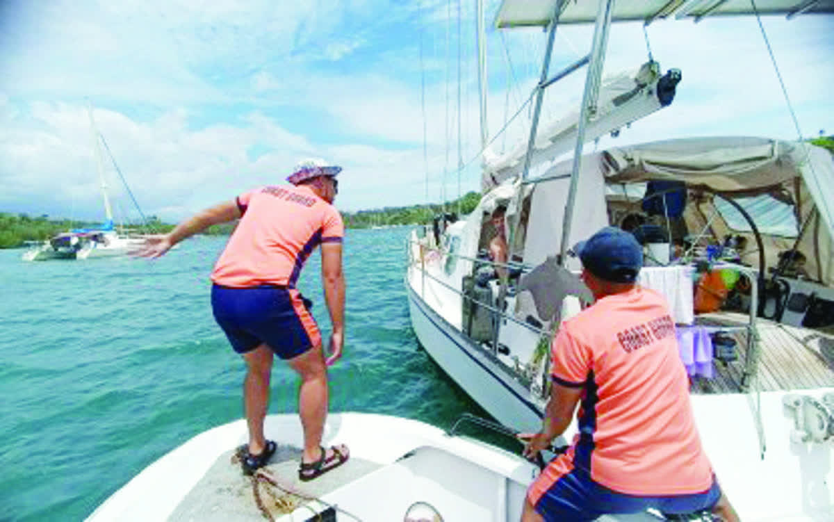 Personnel of the Coast Guard in Negros Oriental inspect yachts in Tambobo Bay, Siaton town on Thursday, February 26, 2026. The team discovered at least 26 "undocumented" vessels, which are at risk of removal if their owners fail to comply with government requirements. (Coast Guard Station - Negros Oriental photo)
