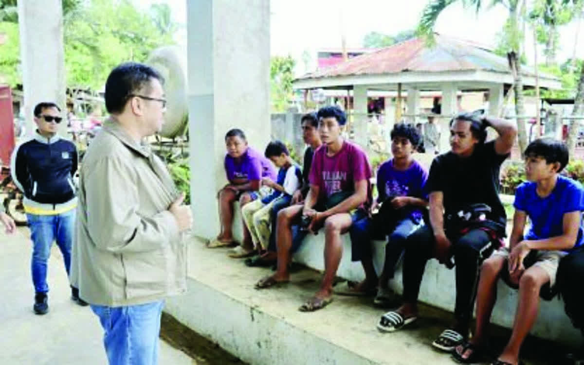 Mayor Jose Pepe Orlino of Tanjay City, Negros Oriental talks to evacuees at the gymnasium in Barangay Sto. Niño. More than 100 individuals fled their homes following skirmishes between government forces and New People's Army remnants in Sto. Niño on Sunday, February 15, 2026, but have now returned to their homes and farms. (Mayor Jose "Pepe" T. Orlino / Facebook photo)