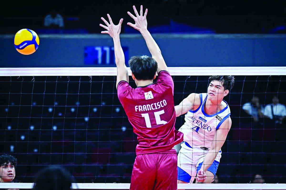 Negrense Jian Salarzon of the Ateneo de Manila University Blue Eagles scores against the defense of the University of the Philippines Fighting Maroons. (UAAP photo)