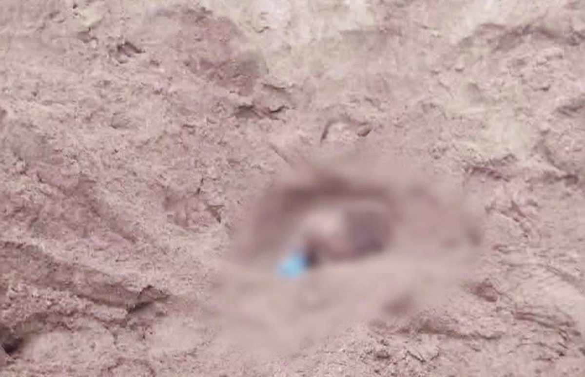 Dead boy found buried in sand
