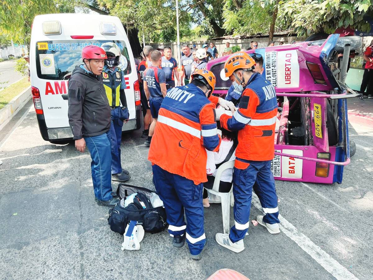 Responders assisted passengers after a pickup truck crashed into a traditional public utility jeepney along Gatuslao Street and South Capitol Road in Bacolod City yesterday morning, March 22, 2026. (Amity Volunteer Fire Brigade photo)