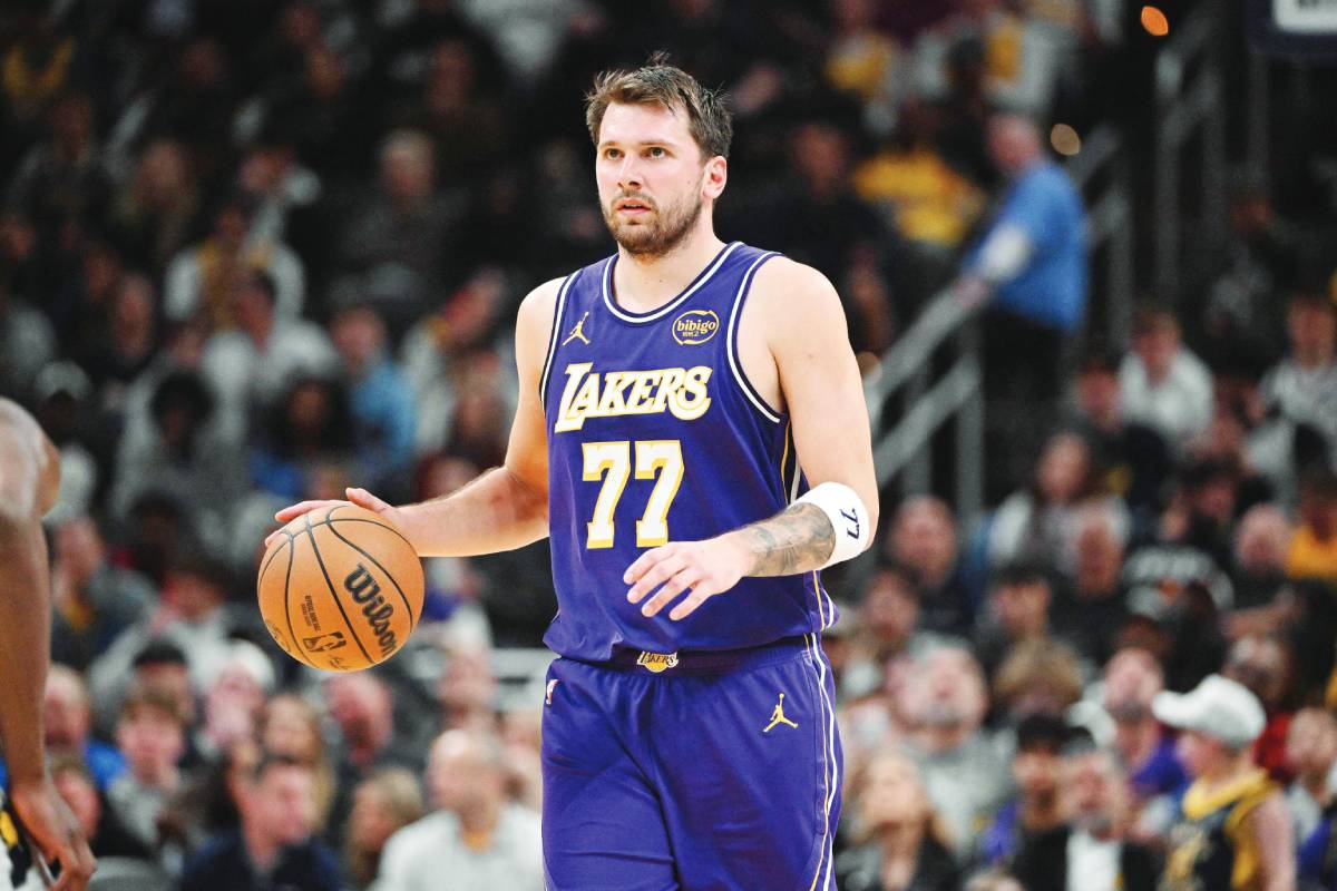 Los Angeles Lakers guard Luka Doncic dribbles the ball down the court during the second half against the Indiana Pacers. (Marc Lebryk / Imagn Images / Reuters)