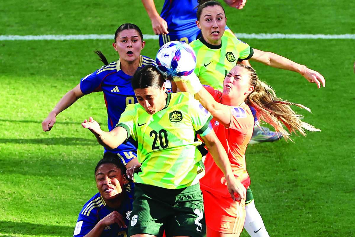 Australia’s Sam Kerr (center) heads the ball as Philippines goalkeeper Olivia McDaniel attempts to block her during the AFC Women’s Asian Cup at Perth Stadium on March 1, 2026. (Antony Dickson / AFP photo)