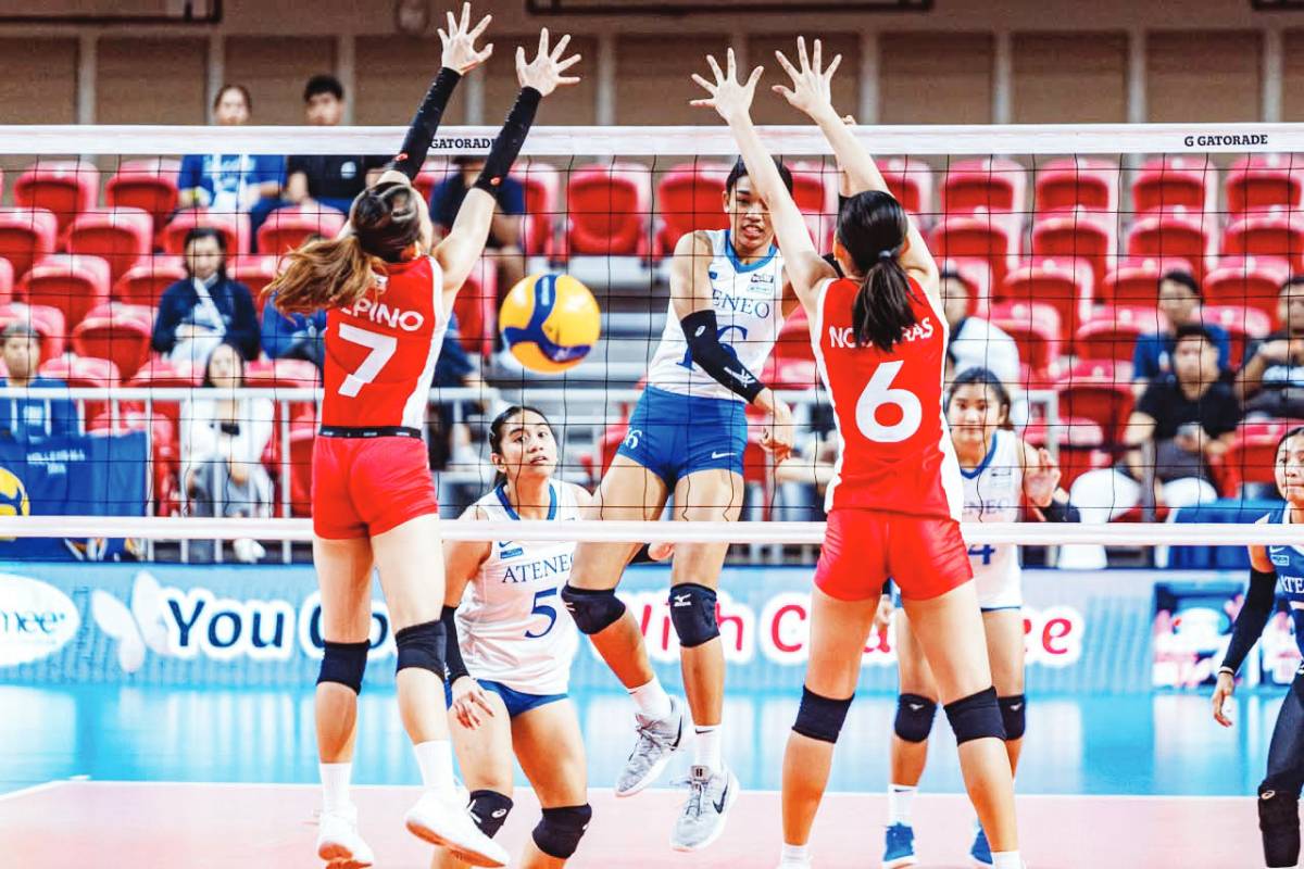 Negrense Dona Mae de Leon of the Ateneo de Manila University Blue Eagles smashes the ball against the defense of the University of the East Lady Warriors. (UAAP photo)
