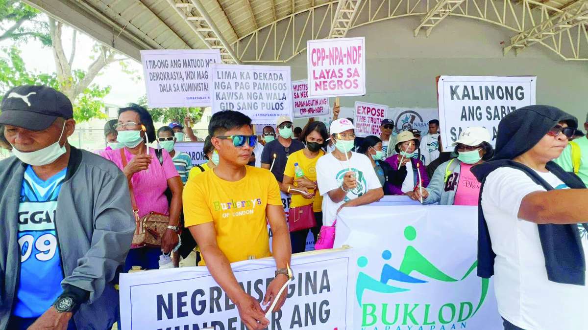 Residents lit candles in Negros Occidental's Toboso town as part of a protest movement to condemn the alleged atrocities of the New People’s Army in the community. (Aksyon Radyo Bacolod photo)