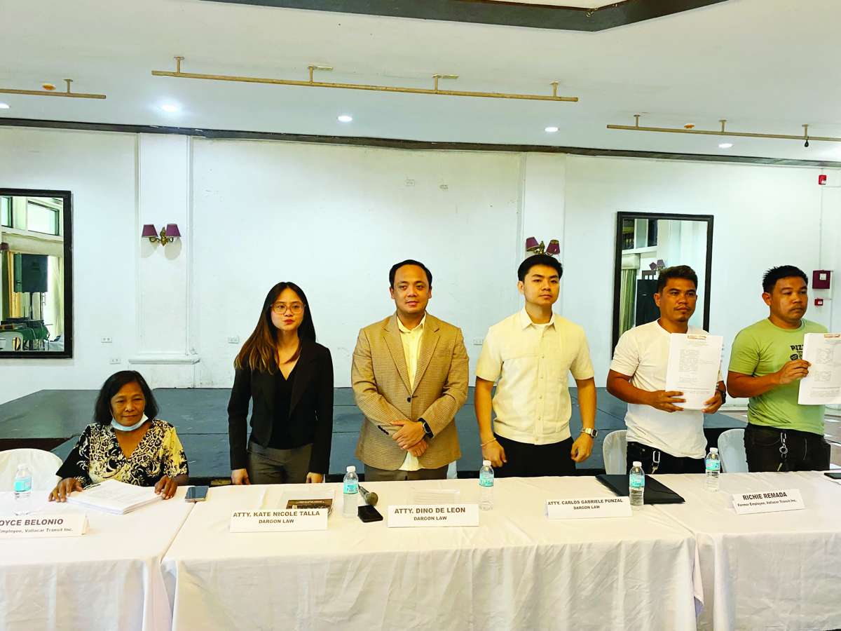 Former employees of Vallacar Transit Inc., with human rights lawyer Dino de Leon (second from left), filed criminal complaints against company officials, claiming they were unlawfully prevented from performing their jobs or pressured into resigning amid a leadership struggle within the company. (Cesar Jolito III / WDJ / Vallacar Transit photos)