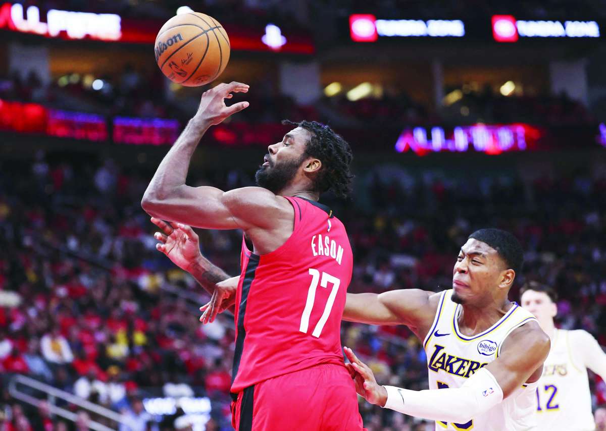 Houston Rockets forward Tari Eason loses control of the ball after being fouled by Los Angeles Lakers guard Marcus Smart. (Troy Taormina / Imagn Images / Reuters)