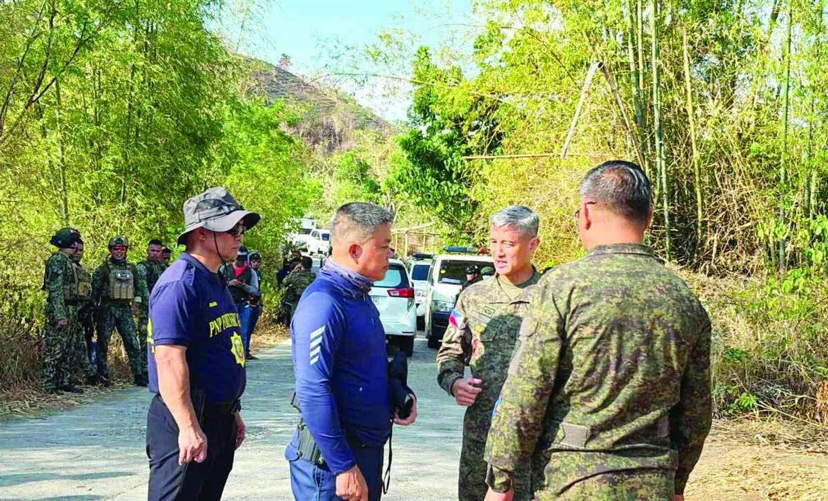 Philippine Army's 302nd Infantry Brigade commander, Brigadier General Jason Jumawan (second from right), visits the area near the encounter site at Barangay Abaca in Negros Occidental’s Cauayan on Sunday, May 17, 2026. Five alleged New People's Army remnants died during a clash with troops of the 15th Infantry Battalion over the weekend. (Cheng Santillan photo)