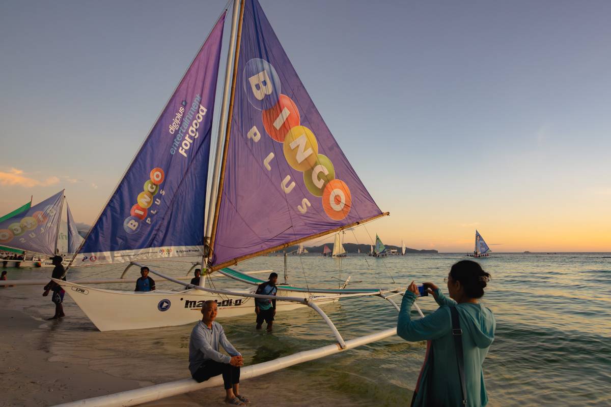 BingoPlus sails through Boracay on paraw boats