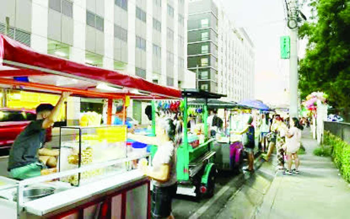 A truckload of rice is offloaded at a wholesale store in Dumaguete City, Negros Oriental in this undated photo. Agriculture authorities warned rice sellers to observe the P50 per kilo price ceiling on imported regular-milled rice set by the government or face sanctions. (PNA / File photo)