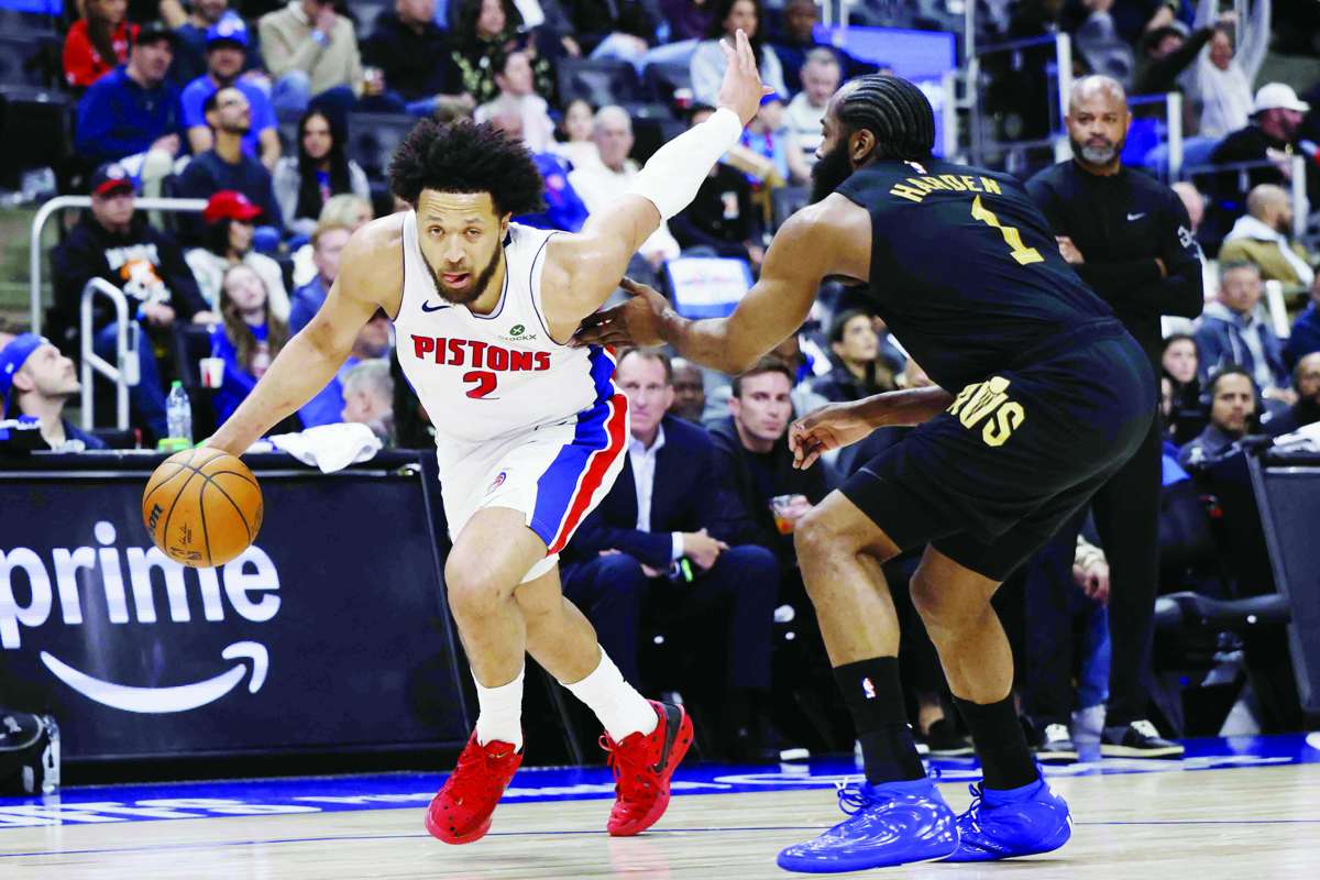 Detroit Pistons guard Cade Cunningham (left) dribbles against Cleveland Cavaliers guard James Harden. (Rick Osentoski / Imagn Images)
