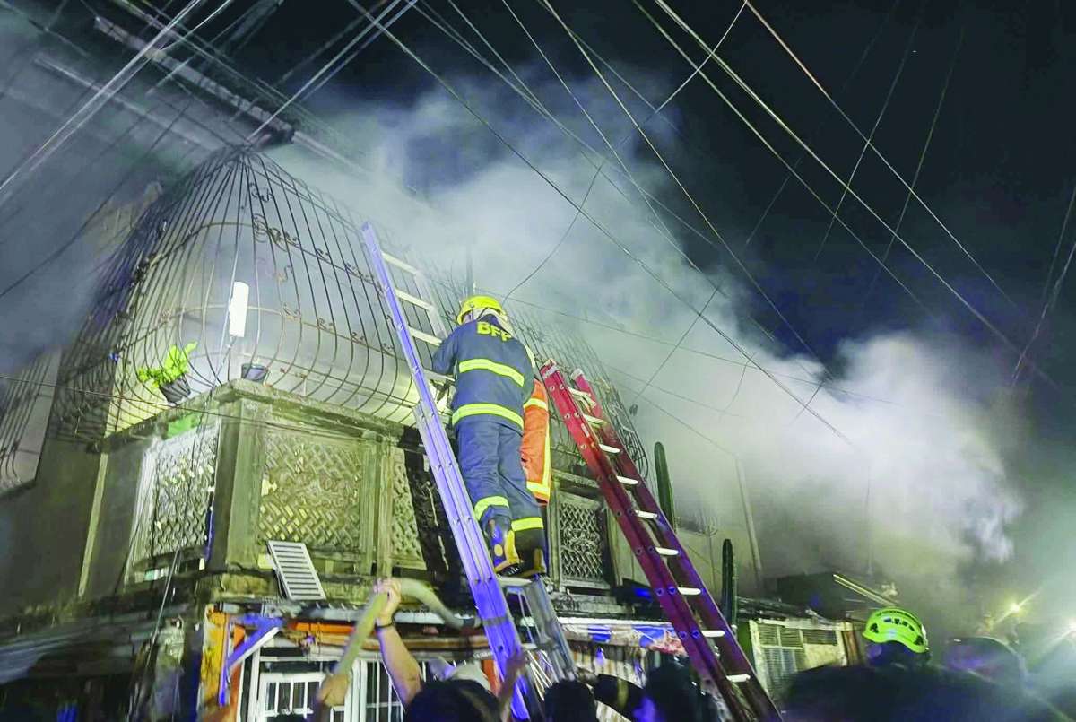 The fire allegedly stemmed from a heated situation after the woman was disturbed by loud sound system noise coming from a nearby covered court directly in front of their residence. (Nikkie Marañon photo)