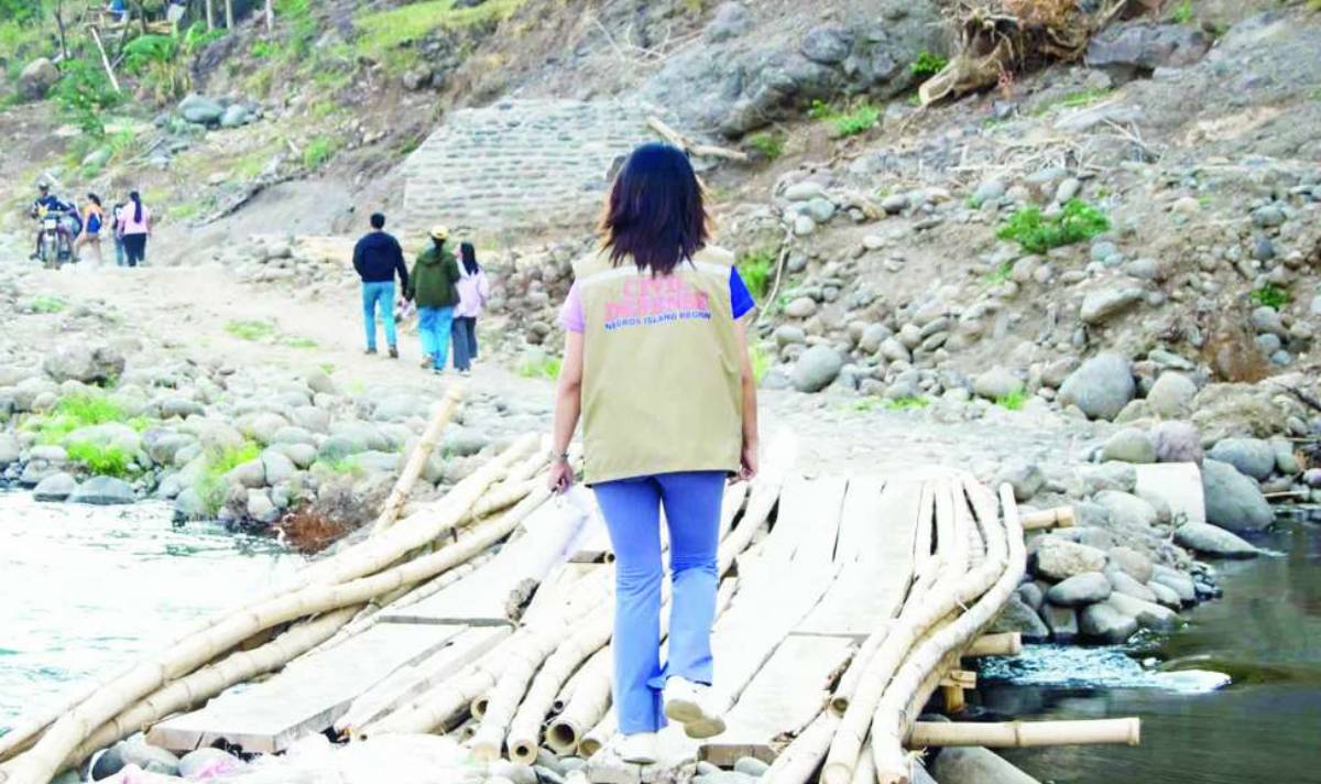 A proposed P250-million bridge will soon connect Barangays Montilla and Macagahay in Negros Occidental’s Moises Padilla town, moving a step closer to realization after the Office of Civil Defense in the Negros Island Region conducted a site inspection at the spillway area heavily damaged when Typhoon “Tino” struck on November 4, 2025. (Moises Padilla LGU photo)