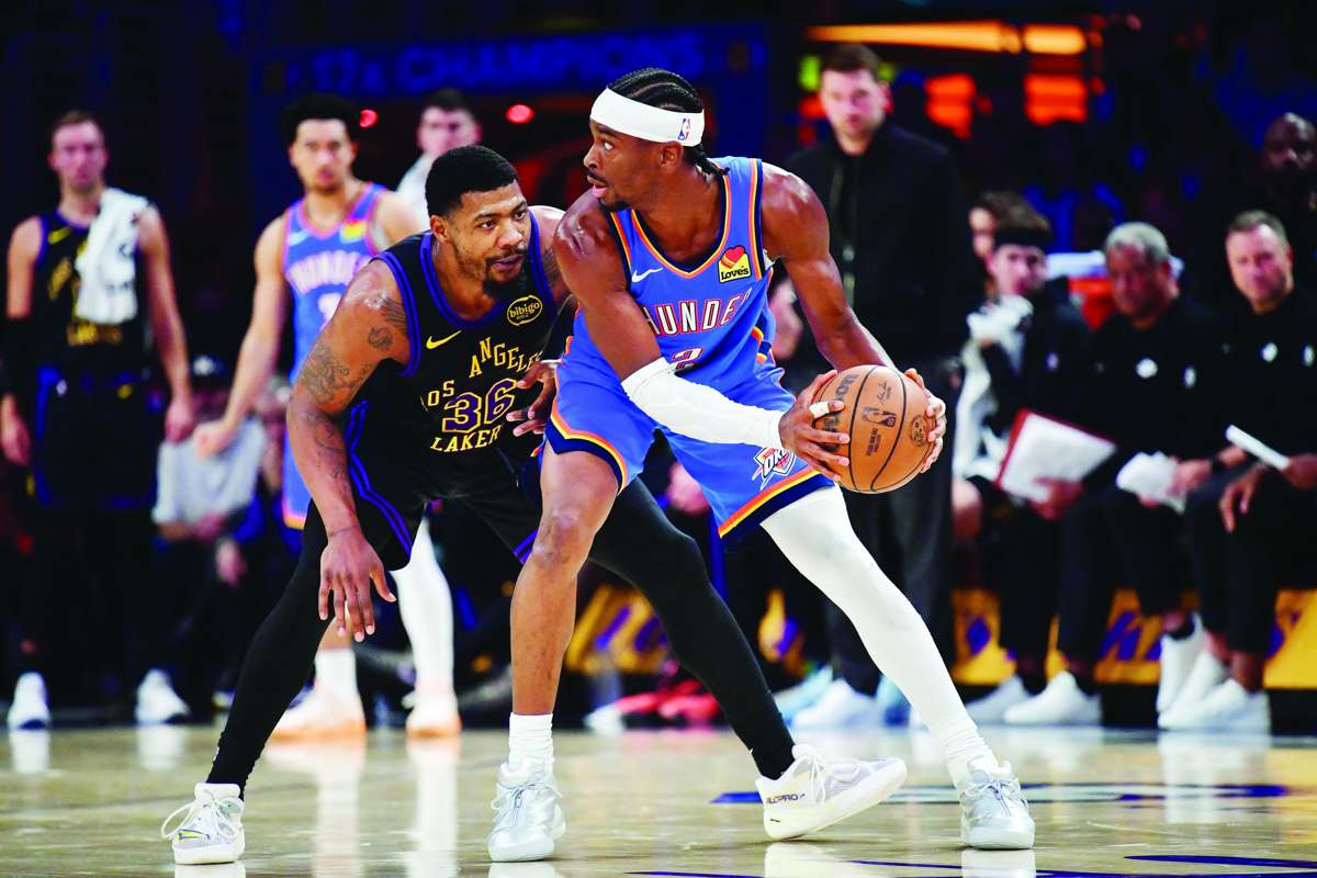 Oklahoma City Thunder guard Shai Gilgeous-Alexander (right) controls the ball against Los Angeles Lakers guard Marcus Smart during Game 4 of the 2026 NBA playoffs. (Gary A. Vasquez / Imagn Images via Reuters)