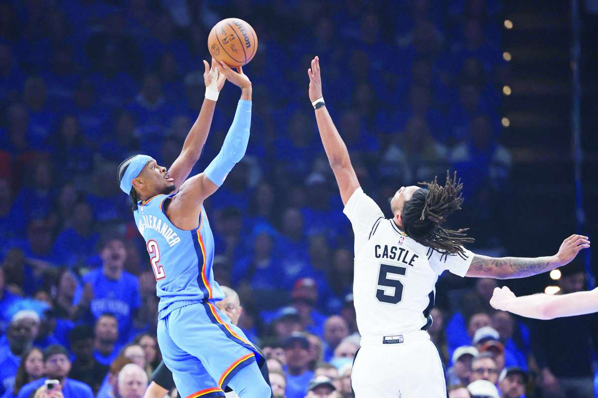 Oklahoma City Thunder guard Shai Gilgeous-Alexander (left) takes a shot as San Antonio Spurs guard Stephon Castle defends during Game 2 of the Western Conference Finals for the 2026 NBA playoffs. (Alonzo Adams / Imagn Images via Reuters)