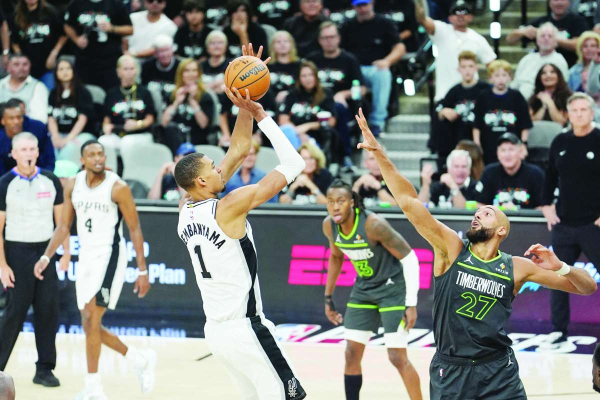 San Antonio Spurs forward Victor Wembanyama (left) shoots over the Minnesota Timberwolves center Rudy Gobert (right) in Game 2 of the 2026 NBA playoffs. (Daniel Dunn / Imagn Images / Reuters photo)