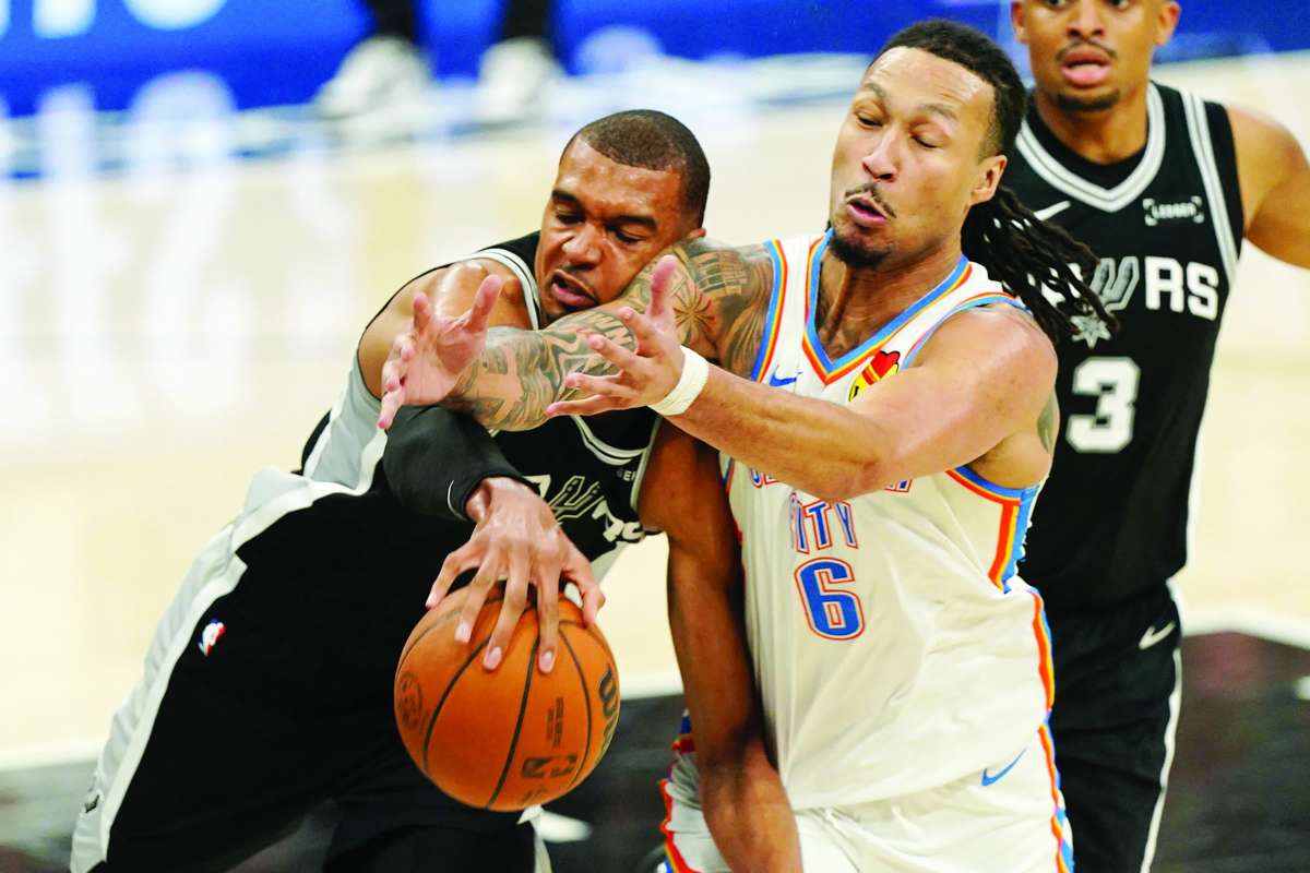 San Antonio Spurs forward Victor Wembanyama (left) and Oklahoma City Thunder forward Jaylin Williams attempt to get a loose ball during Game 6 of the Western Conference finals for the 2026 NBA playoffs. (Dustin Safranek / Imagn Images via Reuters)