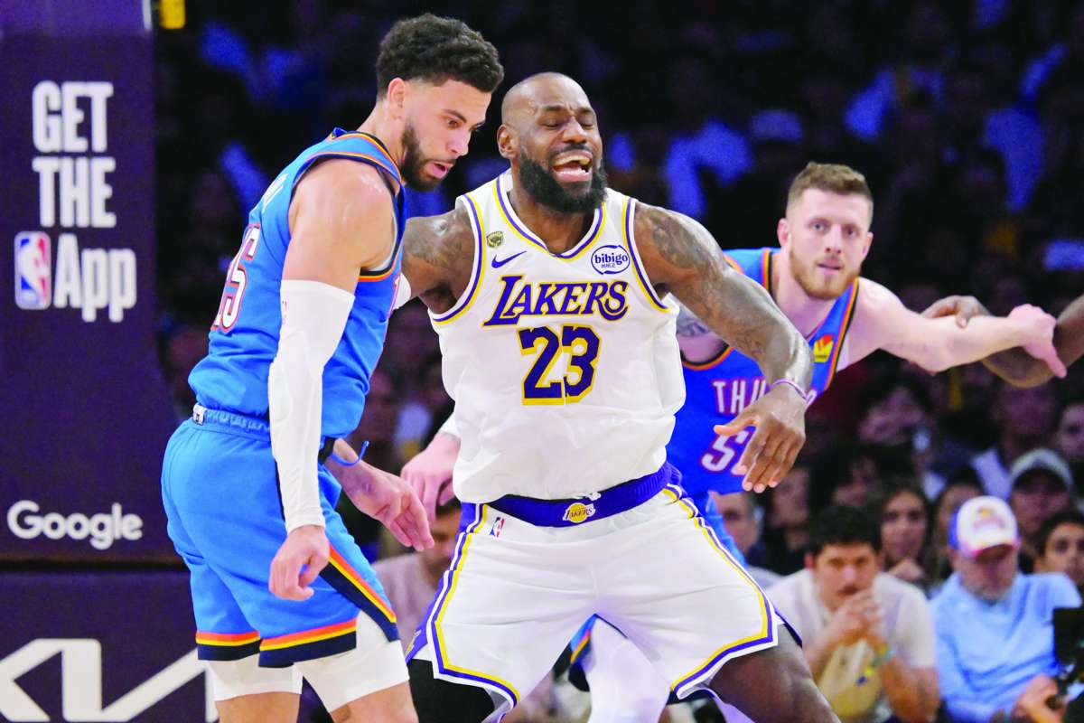 LeBron James (center) reacts as he is defended by Ajay Mitchell (left) in Game 3 of the 2026 NBA playoffs. (Jayne Kamin-Oncea / Imagn Images / Reuters)