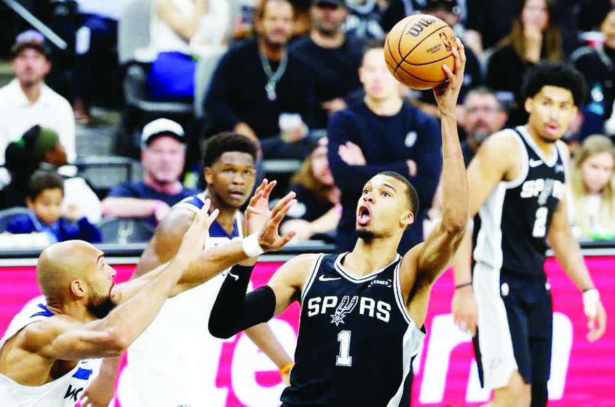 Victor Wembanyama of the San Antonio Spurs shoots the ball against Rudy Gobert of the Minnesota Timberwolves in Game 5 of the NBA Western Conference Playoffs. (Ronald Cortes / Getty Images via AFP)