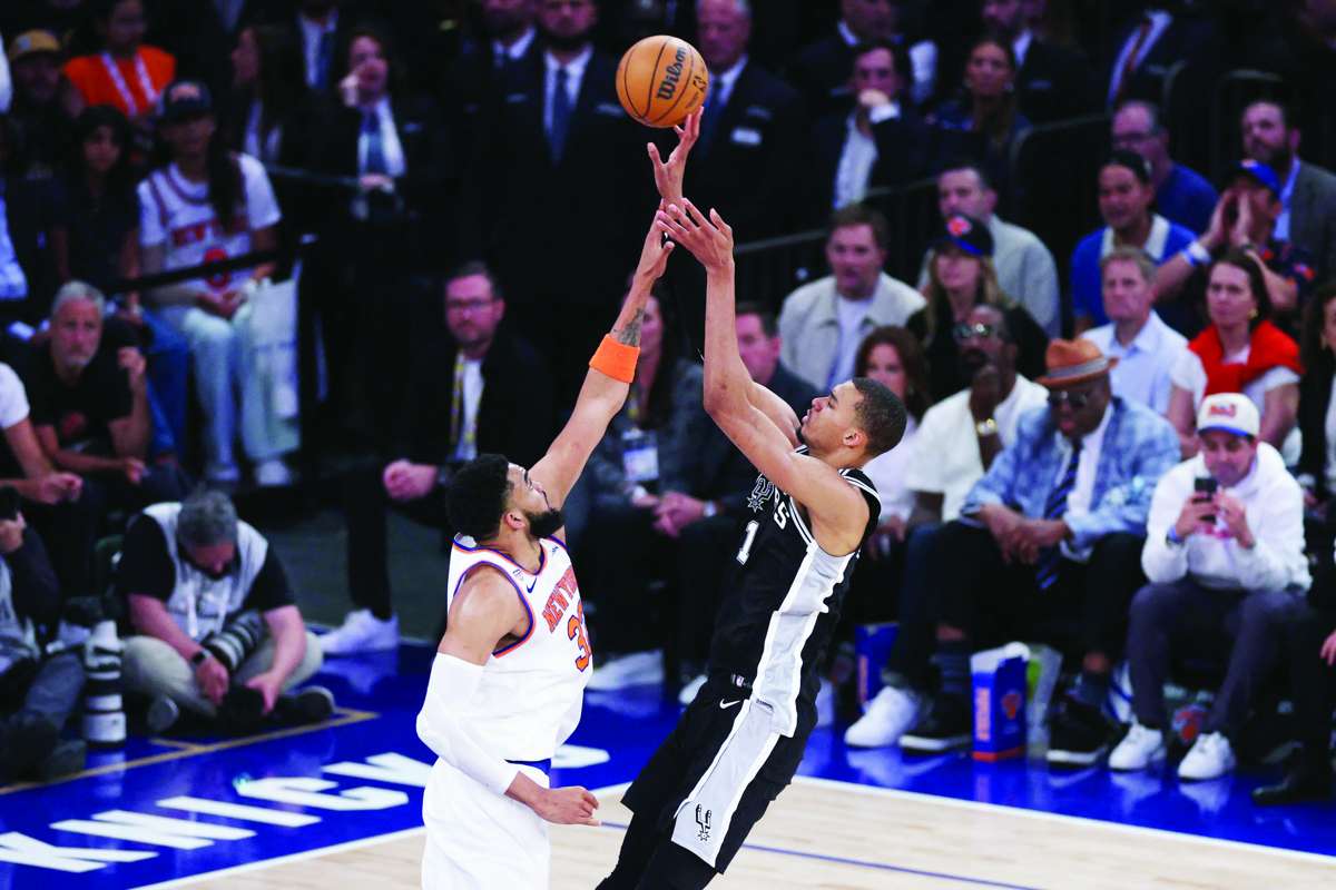 San Antonio Spurs forward Victor Wembanyama (right) shoots against New York Knicks center Karl-Anthony Towns in Game 3 of the 2026 NBA finals. (Vincent Carchietta / Imagn Images via Reuters)