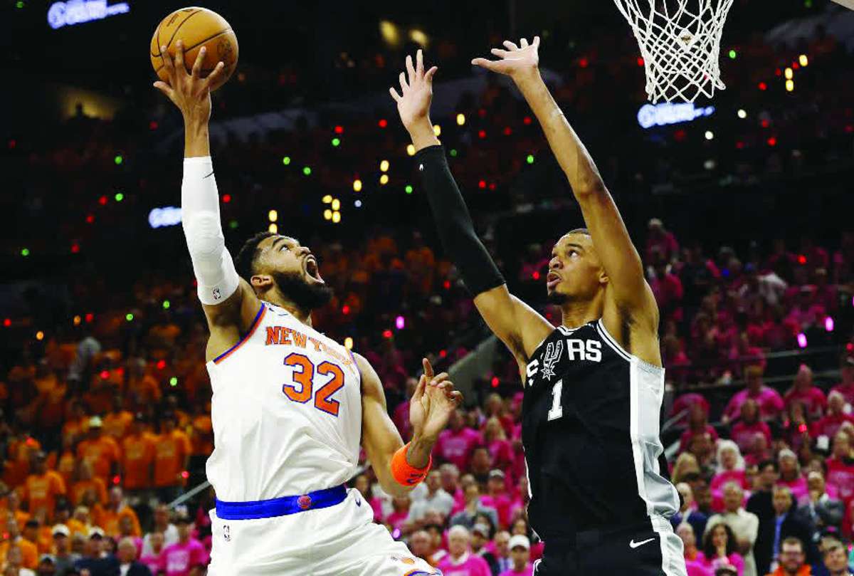 New York Knicks center Karl-Anthony Towns (left) shoots the ball past San Antonio Spurs forward Victor Wembanyama in Game 1 of the 2026 NBA finals. (Geoff Burke / Imagn Images via Reuters)