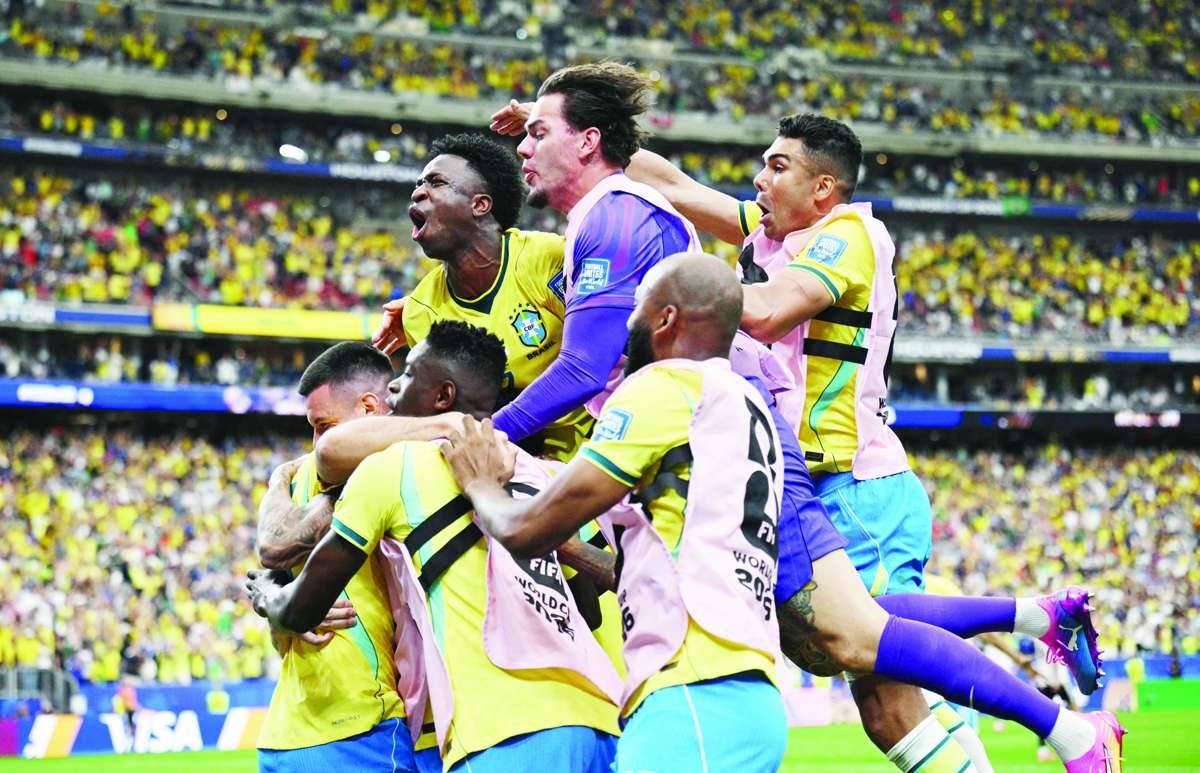 Brazil's Gabriel Martinelli celebrates scoring their second goal with teammates. (Annegret Hilse / Reuters photo)
