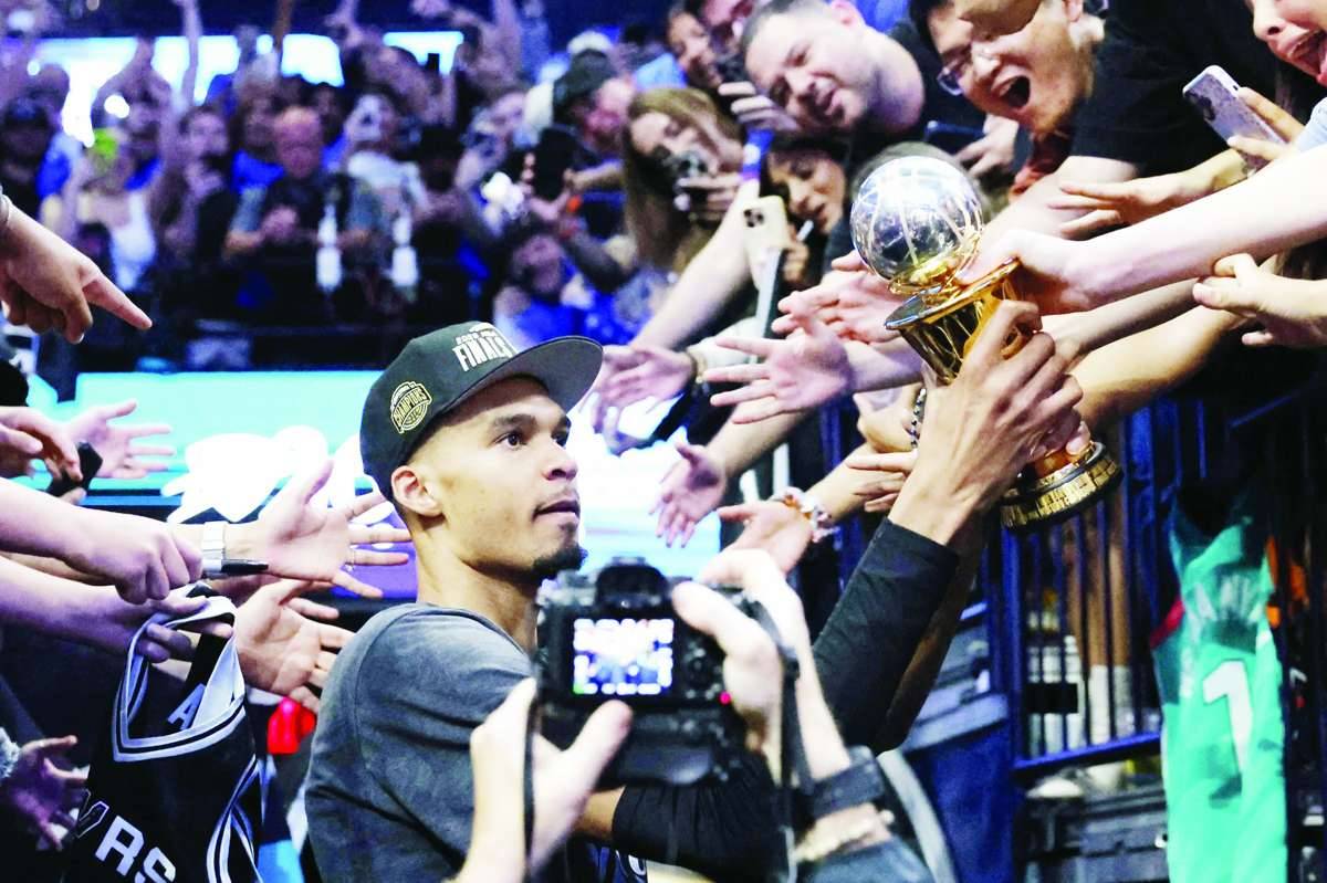 Victor Wembanyama celebrates with the MVP trophy after defeating the Oklahoma City Thunder in Game 7 of the NBA Western Conference finals. (Alonzo Adams / Imagn Images / Reuters)