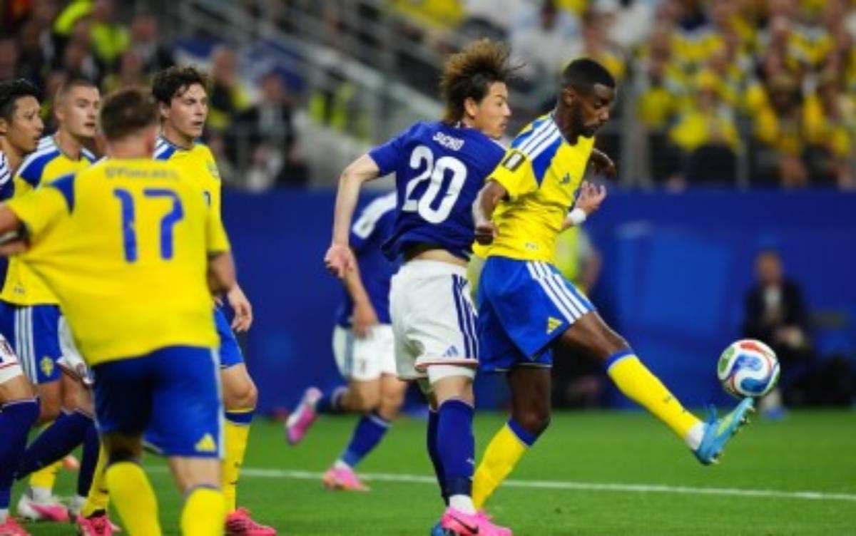 Japan draws with Sweden, 1-1, to secure place in next round