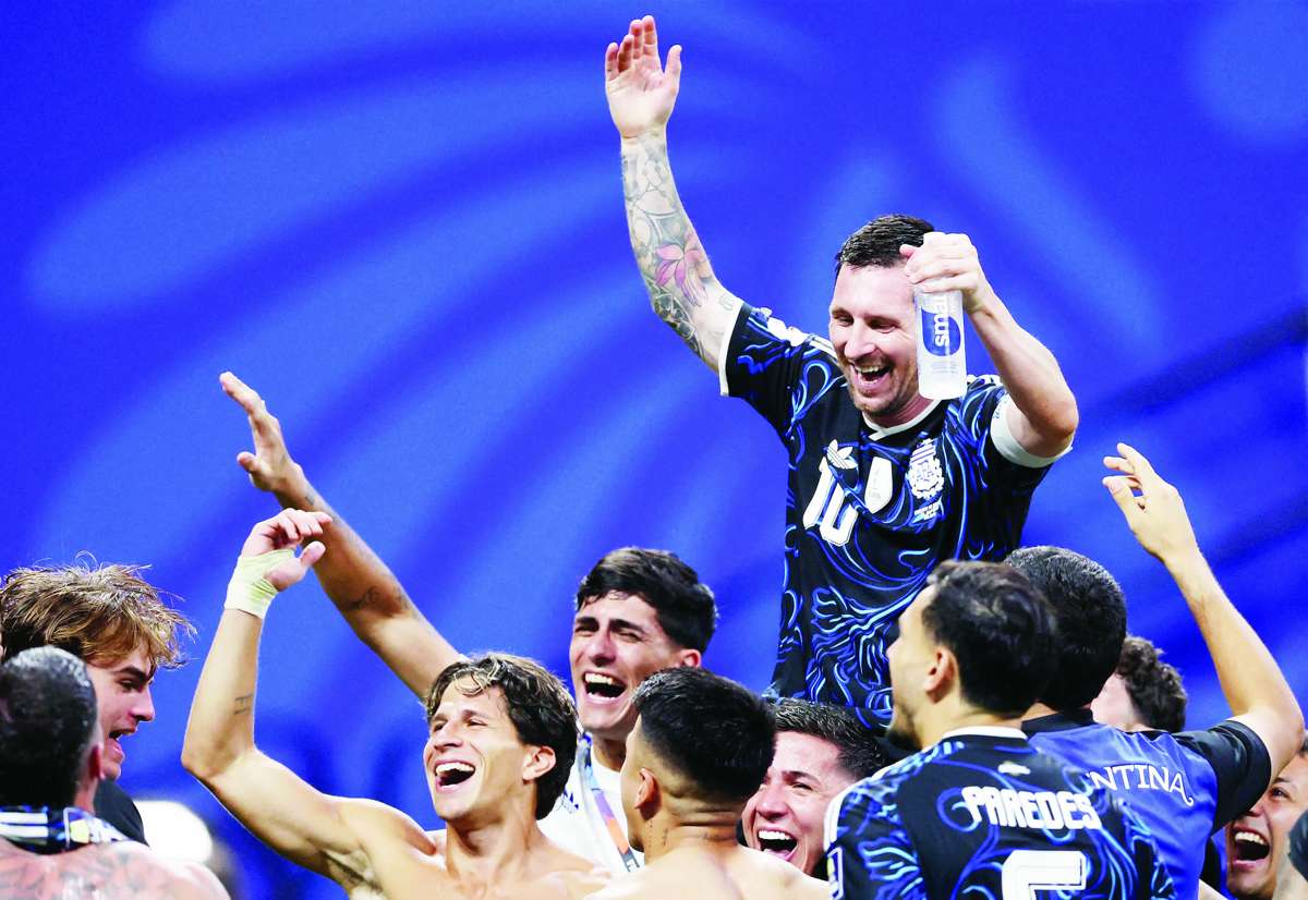 Argentina's Lionel Messi celebrates with teammates after the match. (Brett Davis / Imagn Images via Reuters photo)