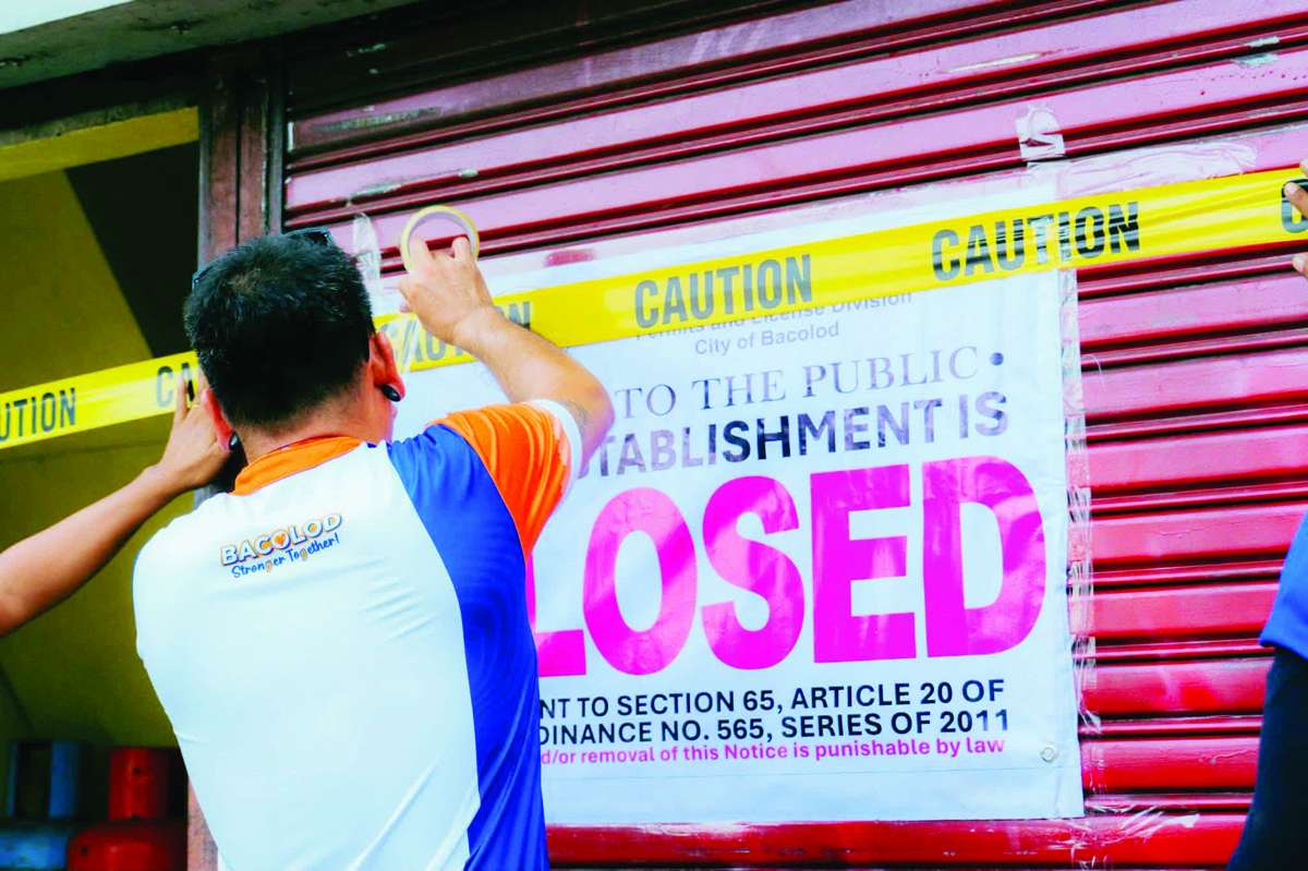 The Bacolod City Legal Office’s enforcement team served closure orders against 19 business establishments at a mall and around Villa Angela East Block on Wednesday, July 15, 2026. Authorities say the establishments continued to operate despite lacking or having incomplete permits and other necessary documents. (BCCO photo)