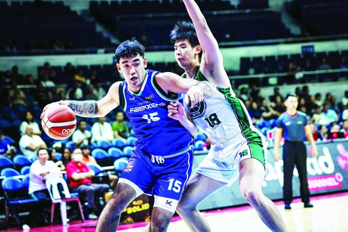 Converge FiberXers’ Justin Arana against Terrafirma Dyip’s Geo Chiu. (PBA photo)