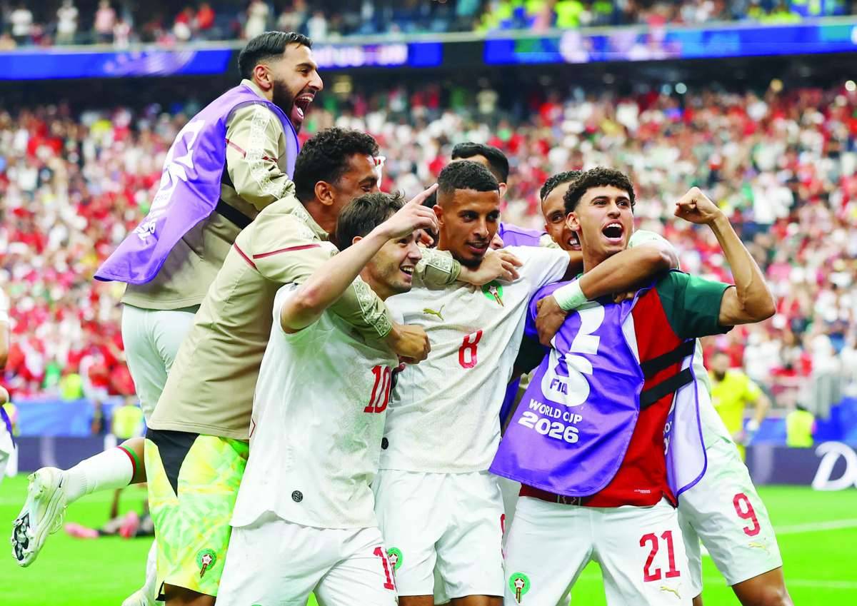 Morocco's Azzedine Ounahi celebrates scoring their second goal with teammates. (Hannah Mckay / Reuters photo)