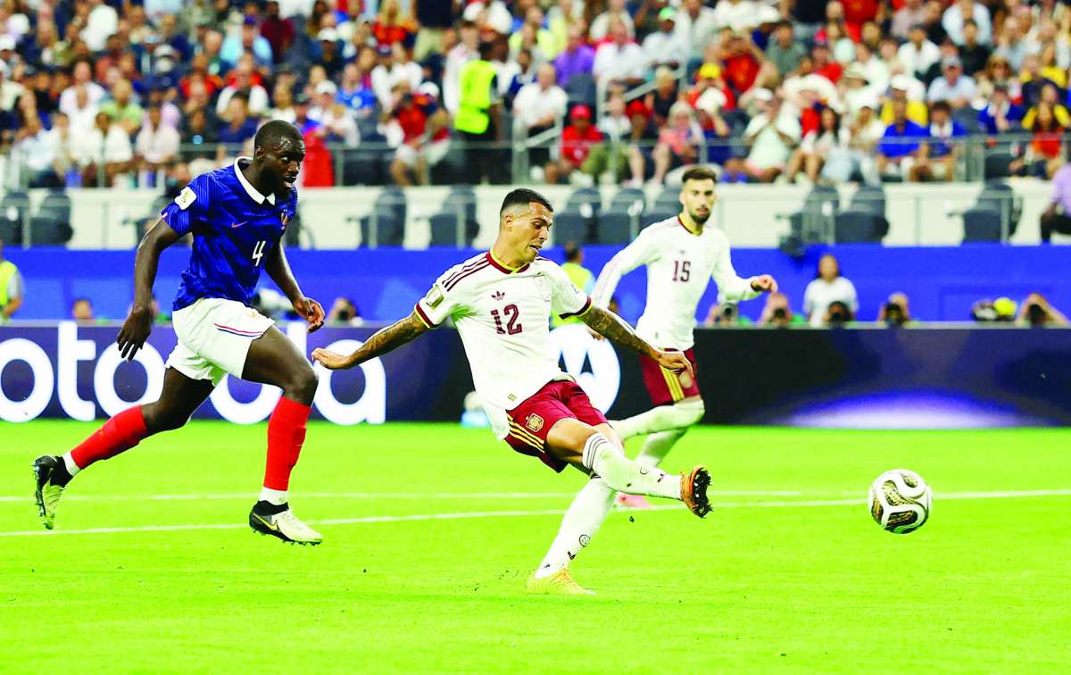 Spain's Pedro Porro scores their second goal. (Hannah Mckay / Reuters photo)