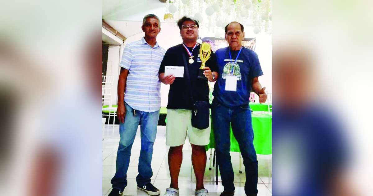 Recarte Tiauson of Negros Occidental’s Talisay City received his prizes after emerging as champion in the Mayor Jose Chubasco Batchuk B. Cardenas invitational FIDE-rated chess tournament. (Contributed photo)